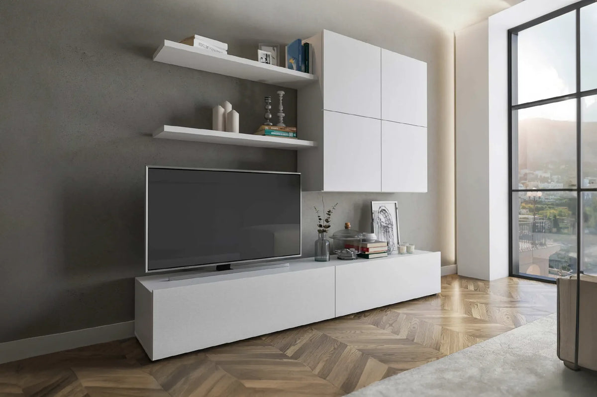 Parete attrezzata Morena finitura bianco frassino con base porta TV, pensili e mensole.