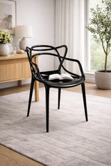 Sedia Curve in policarbonato  nero lucido con design moderno e linee intrecciate