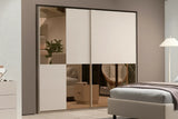 Camera da letto moderna Milano con letto contenitore, armadio scorrevole cashmere con specchi bronzati, comò e comodini