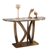 Consolle Roma con base in metallo oro dal design intrecciato e piano effetto marmo in ambiente moderno elegante