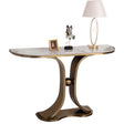 Consolle Venezia con base in metallo oro dal design curvo e piano effetto marmo in ambiente elegante e moderno

