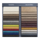 Letto New York imbottito con contenitore salvaspazio, testata trapuntata e piedini alti. Rete a doghe, materiali resistenti e design moderno.