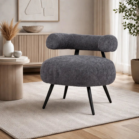 Poltrona Teddy in tessuto bouclé grigio con seduta arrotondata e schienale cilindrico design moderno
