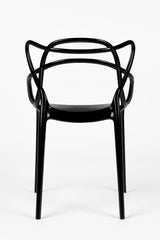 Sedia Curve in policarbonato nero lucido con design moderno e linee intrecciate