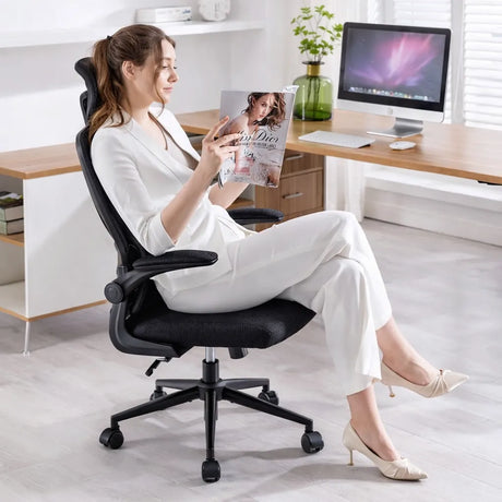 Sedia ufficio ergonomica ErgoPro nera con poggiatesta e schienale in rete traspirante