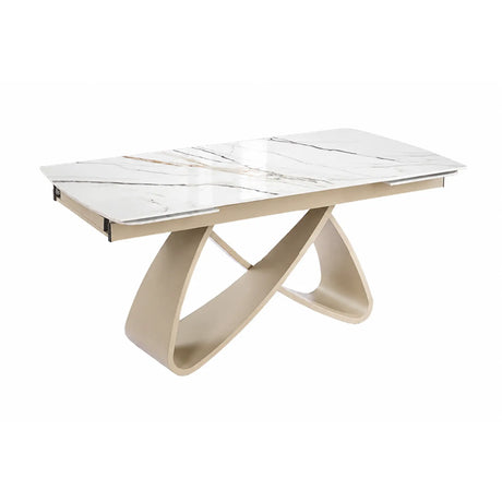 Tavolo allungabile Eros con piano in ceramica effetto marmo oro lucido e struttura in metallo color Champagne da 180 a 260 cm.
