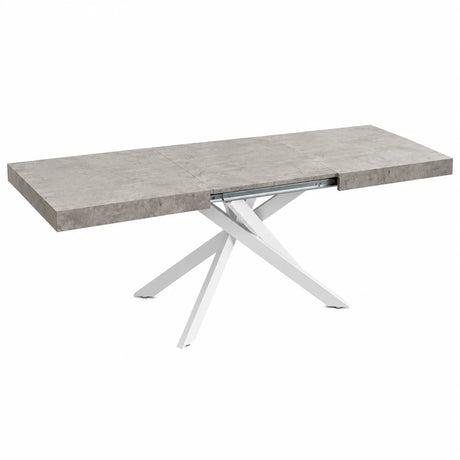 Tavolo allungabile Tokyo con struttura in metallo bianco e piano disponibile in rovere nodato, marmo carrara e cemento.