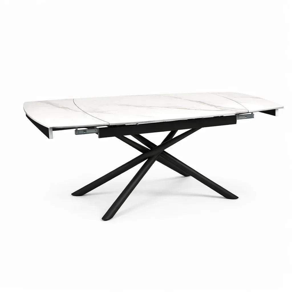 Tavolo allungabile a botte con piano in ceramica calacatta oro lucido o carrara opaco e base in metallo oro o nero.