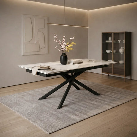 Tavolo George allungabile con piano in ceramica effetto marmo e base in metallo nero design incrociato moderno