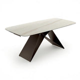 Tavolo Thanos X allungabile con piano in ceramica effetto marmo Calacatta Oro e struttura in metallo bronzo