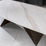 Tavolo Thanos X allungabile con piano in ceramica effetto marmo Calacatta Oro e struttura in metallo bronzo