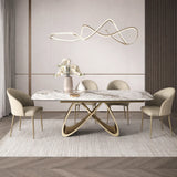 Tavolo Wings allungabile in ceramica effetto marmo calacatta con base intrecciata color champagne