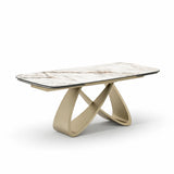 Tavolo Wings allungabile in ceramica effetto marmo calacatta con base intrecciata color champagne